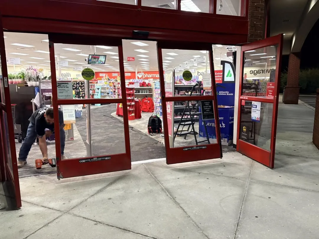 Target store automatic entrance doors being repaired at night by GHK technician